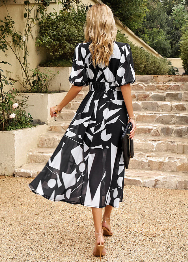 Mella | The Smocked Floral Midi
